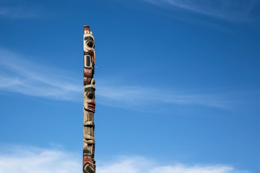 Totem pole in front of heaven