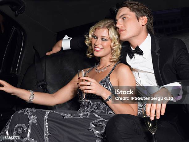 Couple With Champagne Flutes In Limousine Stock Photo - Download Image Now - Adult, Beautiful People, Beauty