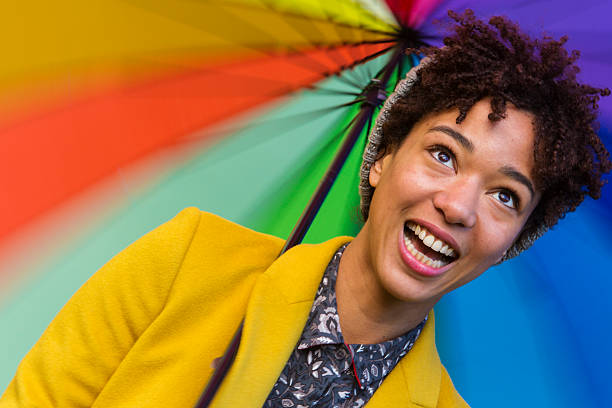 istock Young Woman With Bright Umbrella 462866857