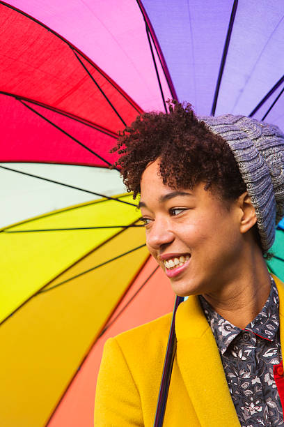 istock Young Woman With Bright Umbrella 462866859