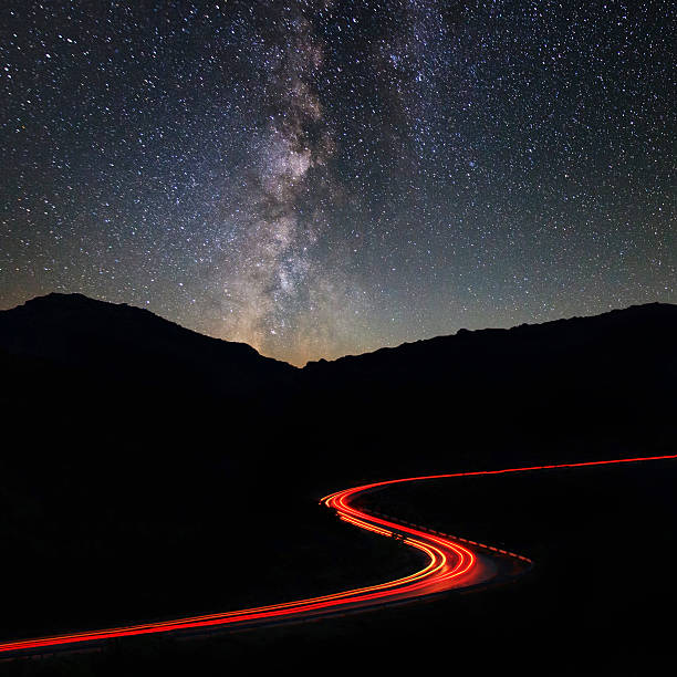 istock Road in mountains under the Milky Way 462868635