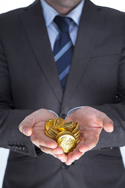 istock Business man holding golds in hands 462868847