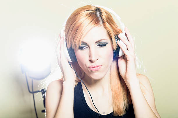 istock Ginger Girl with headphones 462871211