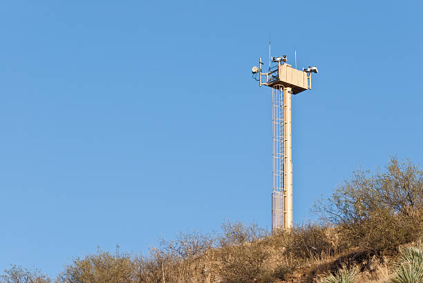 Surveillance Tower on the USA - Mexico Border A surveillance tower guards the USA-Mexico Border between Nogales, Arizona, USA and Nogales, Sonora, Mexico. jeff goulden southwest usa stock pictures, royalty-free photos & images