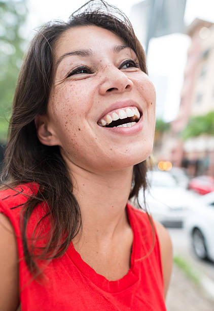 istock young hispanic woman laughing 462872251