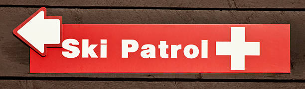 Ski Patrol sign Ski Patrol sign on building. ski patrol photos stock pictures, royalty-free photos & images