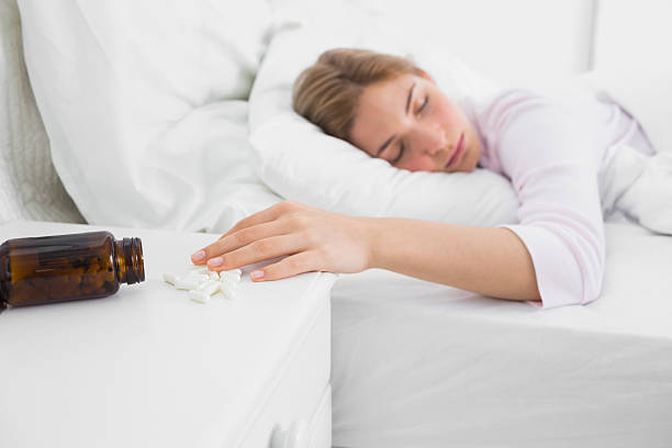 istock Pretty young woman lying motionless after overdose 462873325