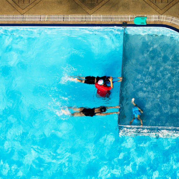 istock People exercising in a swimming pool 462874977