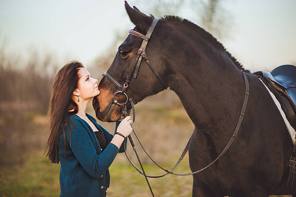 istock Young woman with a horse on nature 462878189