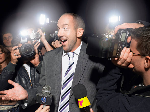 istock Surprised Man Surrounded By Paparazzi 462903525
