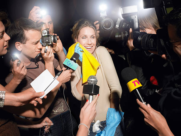 istock Female Cleaner Surrounded By Paparazzi 462903539