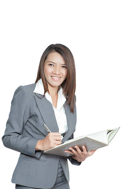 istock Business woman attractive standing using a pen writing diary 462903941