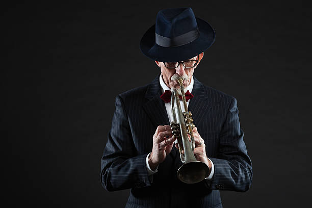 istock Senior jazz musician. Trumpet player. Studio shot. 462907857