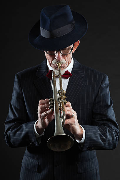 istock Senior jazz musician. Trumpet player. Studio shot. 462908143