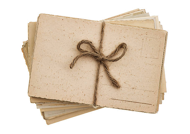 istock pile of old postcards isolated on white 462908397