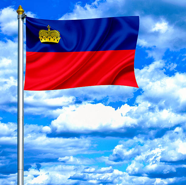 istock Liechtenstein waving flag against blue sky 462911687
