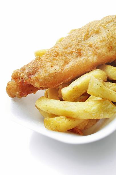 istock traditional British fish and chips on retail tray 462915661