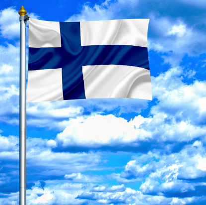Finland waving flag against blue sky