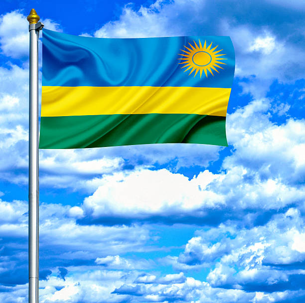 istock Rwanda waving flag against blue sky 462938335