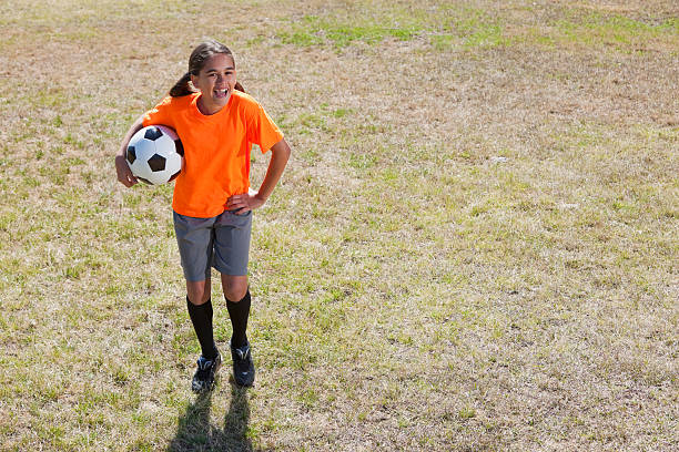 istock Girl playing soccer 462940737