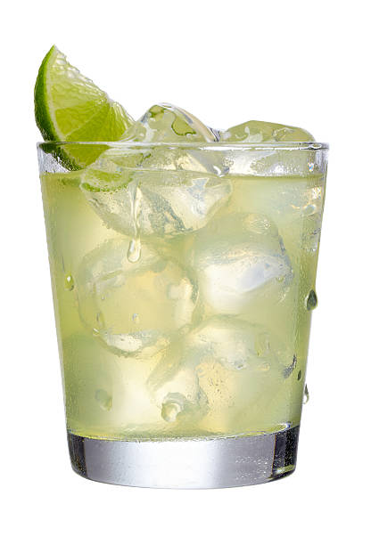 Margarita Margarita in a short glass on the rocks with a lime wedge.  Professionally shot, color corrected, exported 16 bit and retouched for maximum image quality, larger files include clipping path. margarita stock pictures, royalty-free photos & images