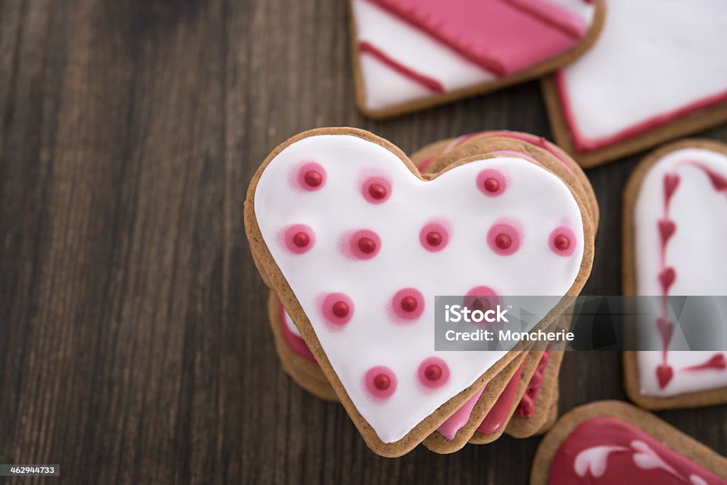 Heart shaped ginger cookies on wooden background Affectionate Stock Photo