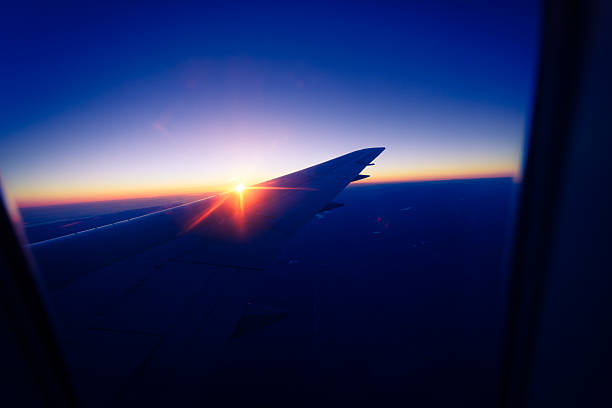Commercial Airplane Wing at Sunrise
