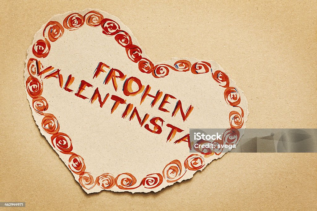Note "Happy Valentine's Day" written on grunge heart This is Valentine's day postcard with note "Frohen Valentinstag" hand-written on grunge heart Brown Paper Stock Photo