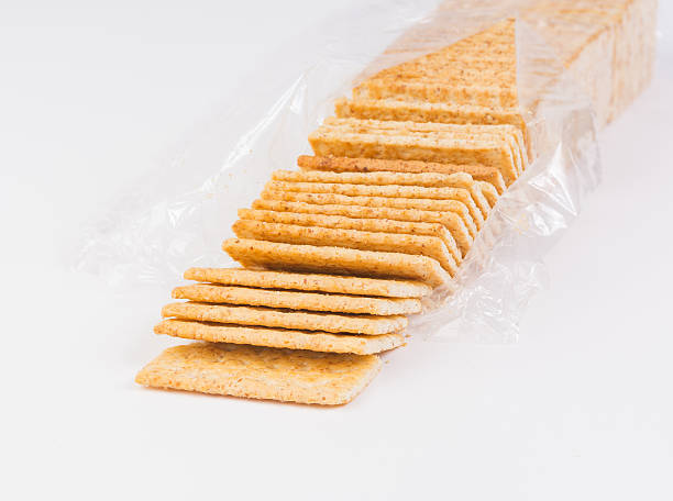 istock Bag of fresh organic whole grain crackers on white background 462953225