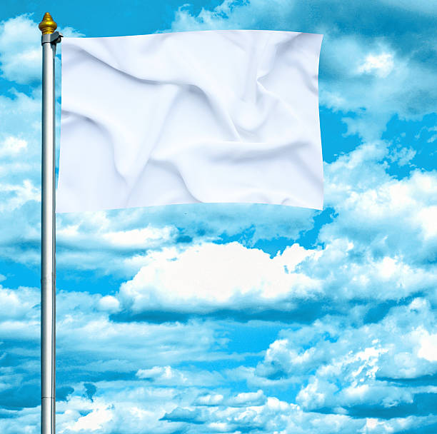istock White flag waving on the wind against blue sky 462959223