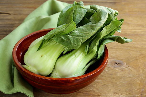 istock Bok choy (chinese cabbage) on a wooden table 462959243