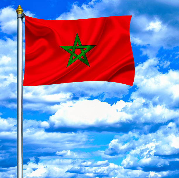 istock Morocco waving flag against blue sky 462960405