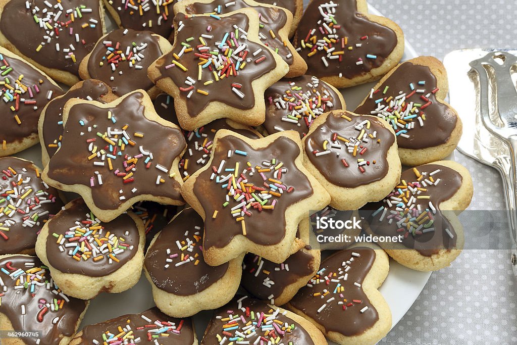 Shortbread cookies with chocolate icing Shortbread christmas cookies with chocolate icing on the plate Baked Pastry Item Stock Photo