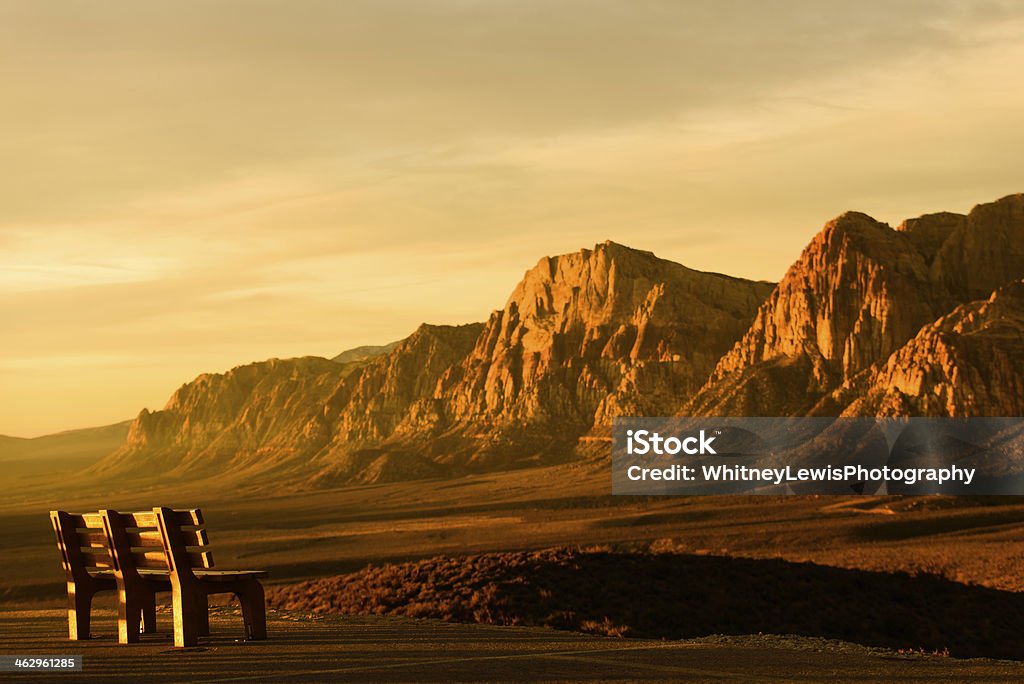 Red Rock Canyon - A Place to Sit A bench at a scenic view of a mountain.  Red Rock Canyon National Conservation Area, Nevada. National Park Stock Photo