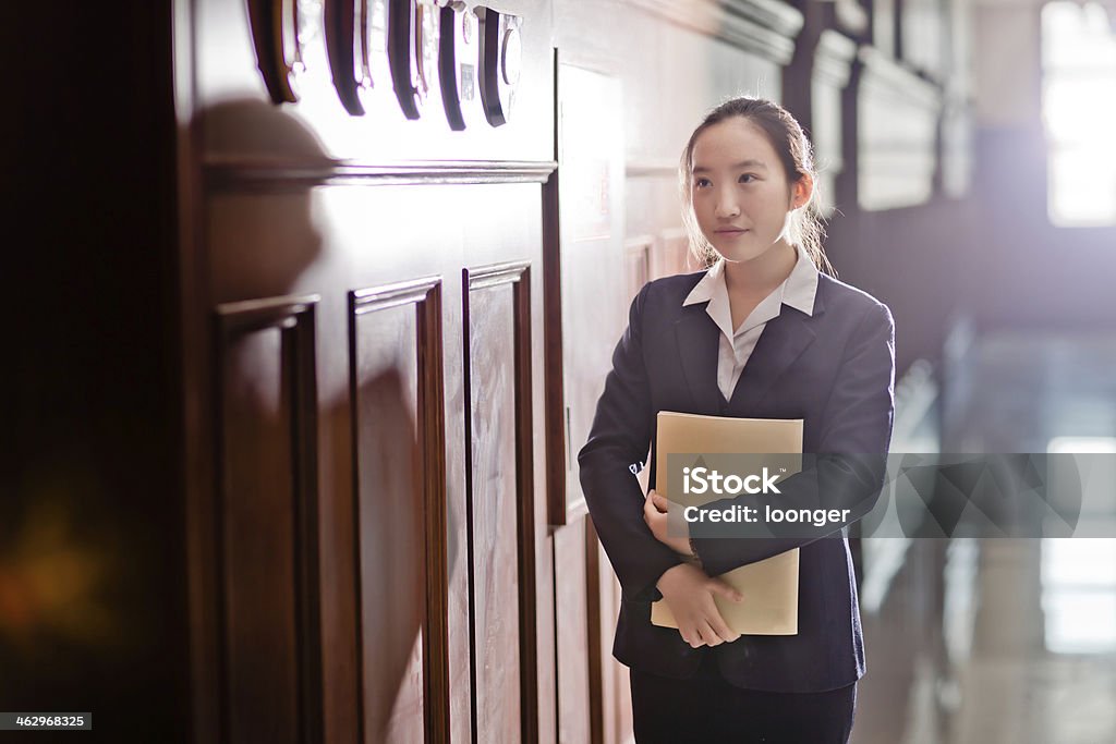 East asian senior high school student East asian senior high school student standing in the corridor 16-17 Years Stock Photo