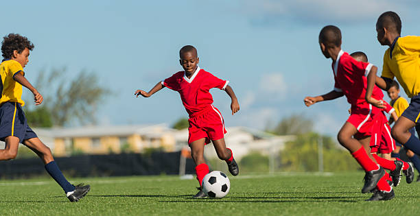 istock Young Boys Playing Football 462968331