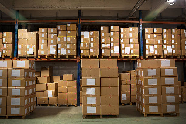 Large number of boxes stacked in warehouse Warehouse full of boxes. medium group of objects stock pictures, royalty-free photos & images
