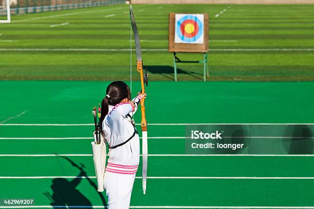 Teenage Girl Archer Aiming At Target Stock Photo - Download Image Now - Archery, Sports Target, Teenage Girls