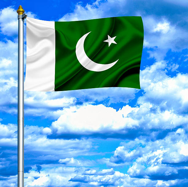istock Pakistan waving flag against blue sky 462969903
