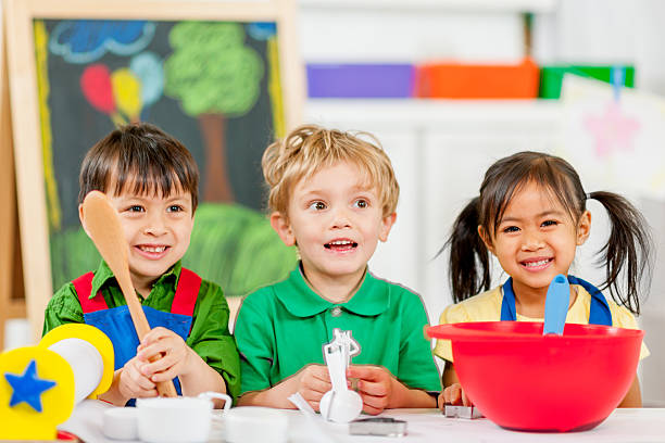 istock Group of kids making cookies 462970815