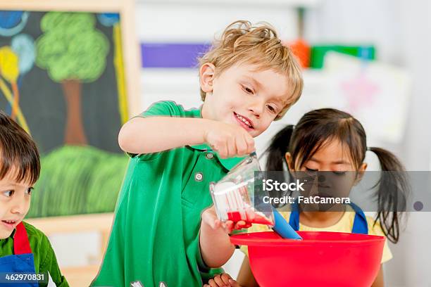 Group Of Kids Making Cookies Stock Photo - Download Image Now - Dry Measure, 4-5 Years, Apron