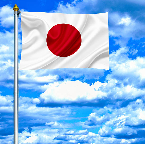 istock Japan waving flag against blue sky 462979161