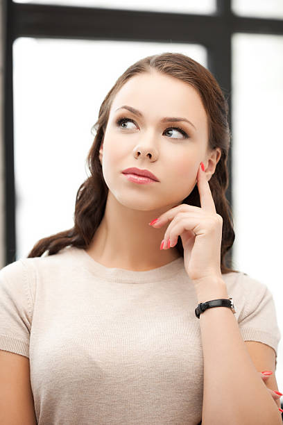 istock calm and serious thinking woman 462984765
