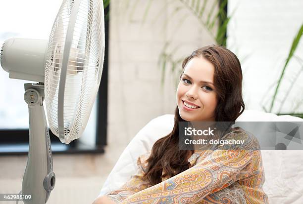 Happy And Smiling Woman Sitting Near Ventilator Stock Photo - Download Image Now - Cool Attitude, Electric Fan, Fan - Enthusiast