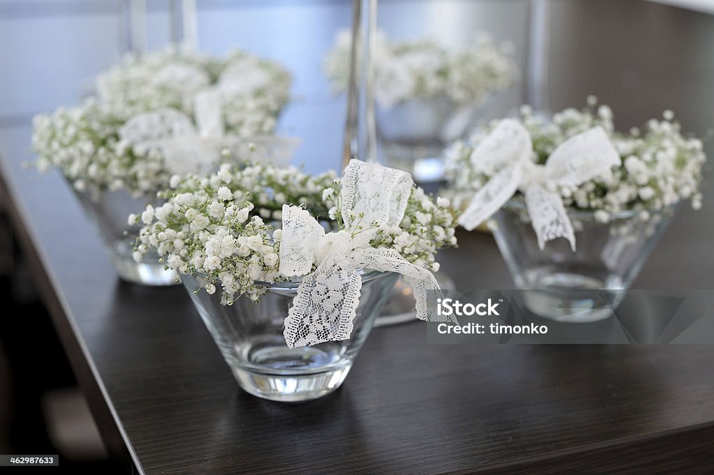 wedding flower decoration beautiful floral arrangement in white for the reception Banquet Stock Photo
