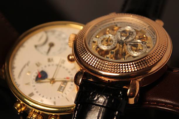 istock Two golden luxury chronometers (macro) 462989035