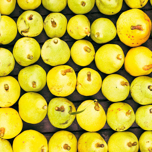 Freshly picked yellow pears at a famers market closeup,