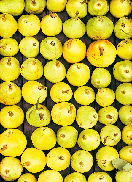 Freshly picked yellow pears at a famers market closeup