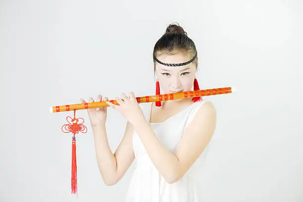 Photo of China beauty in blowing the flute