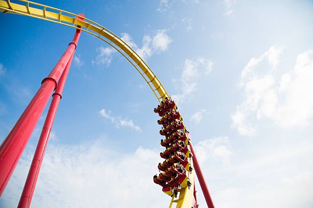 istock Skyward view of the loop of a roller coaster 462998131